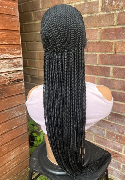 Perruque tressée passe mèche tous derrière